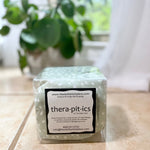 cherry pit therapy pack on a surface with a plant in the background