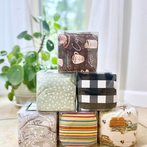 Stack of decorative therapy packs with various patterns in a home setting