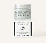 Activated charcoal deodorant cream jar with label on a white background
